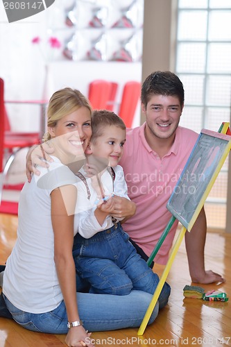 Image of family drawing on school board at home