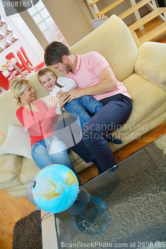 Image of family have fun with globe