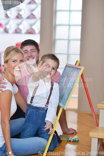 Image of family drawing on school board at home