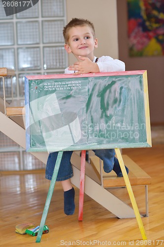 Image of family drawing on school board at home