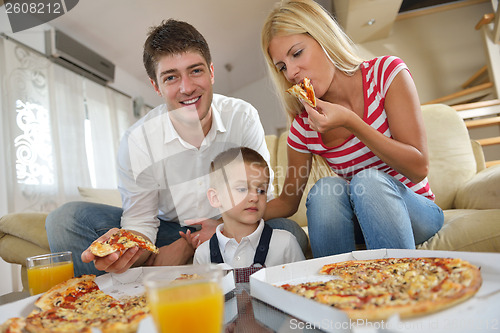 Image of family eating pizza