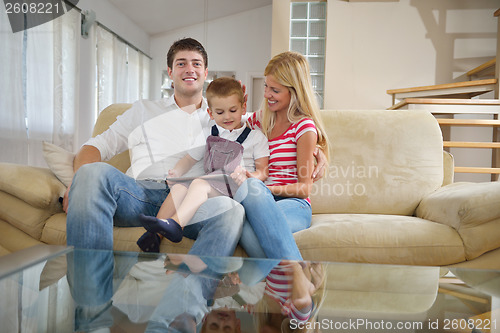 Image of family at home using tablet computer