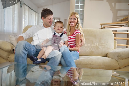 Image of family at home using tablet computer