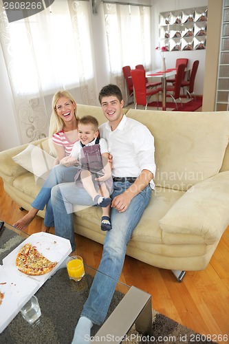 Image of family at home using tablet computer