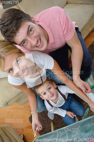 Image of family drawing on school board at home