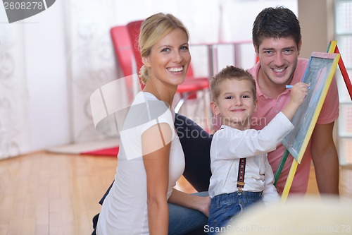 Image of family drawing on school board at home