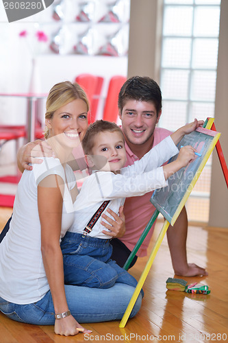 Image of family drawing on school board at home