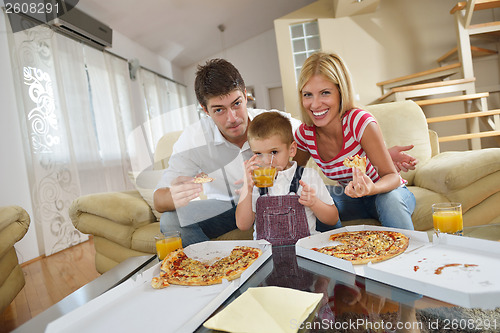 Image of family eating pizza