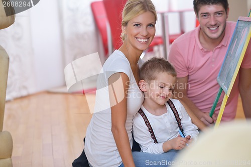 Image of family drawing on school board at home