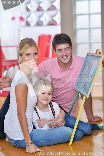 Image of family drawing on school board at home