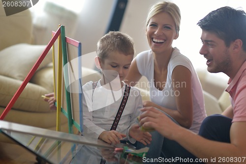 Image of family drawing on school board at home