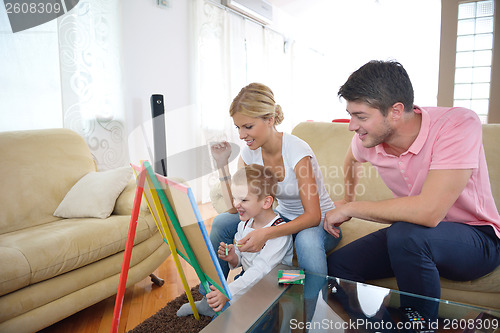 Image of family drawing on school board at home