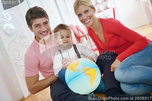 Image of family have fun with globe