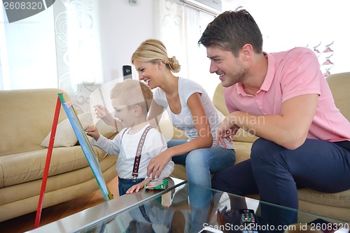 Image of family drawing on school board at home