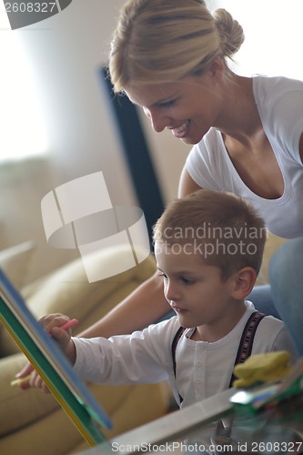 Image of family drawing on school board at home