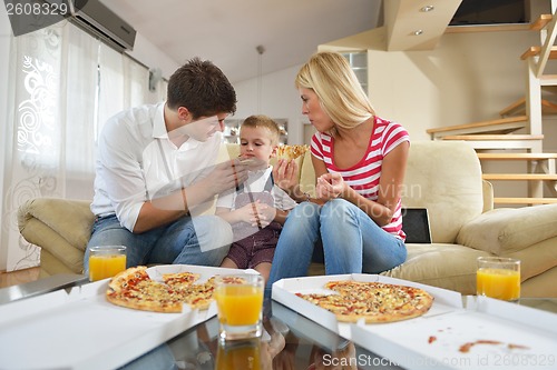 Image of family eating pizza