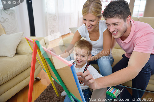 Image of family drawing on school board at home