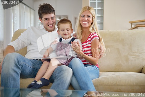 Image of family at home using tablet computer