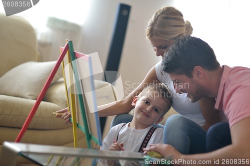 Image of family drawing on school board at home