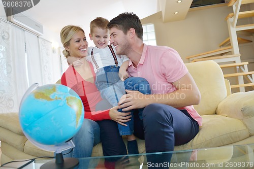 Image of family have fun with globe