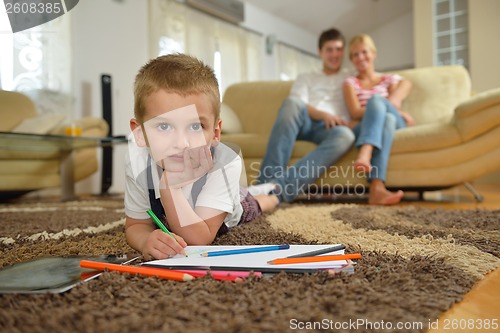 Image of family drawing on school board at home