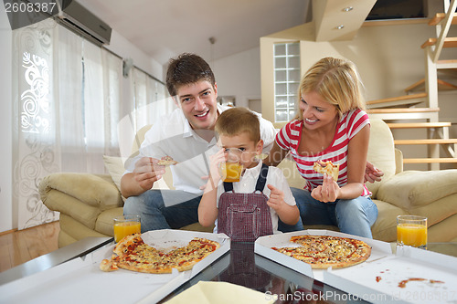 Image of family eating pizza