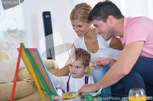 Image of family drawing on school board at home