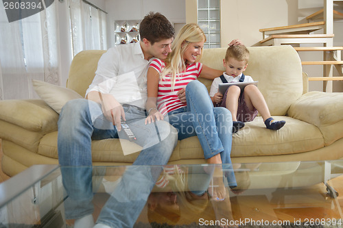Image of family at home using tablet computer