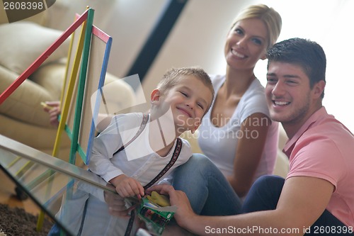 Image of family drawing on school board at home