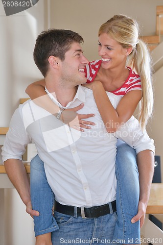 Image of Relaxed young  couple watching tv at home