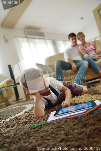 Image of family at home using tablet computer