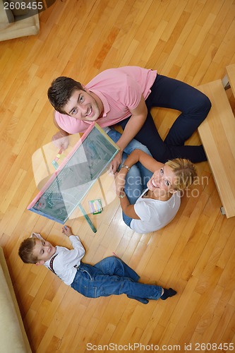 Image of family drawing on school board at home