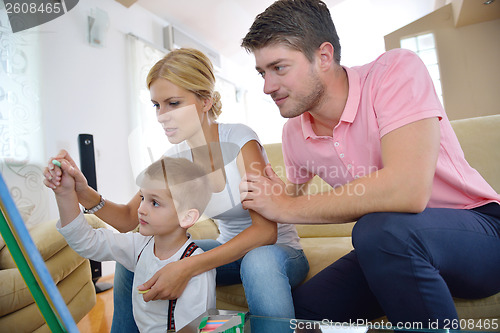 Image of family drawing on school board at home