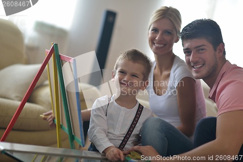 Image of family drawing on school board at home