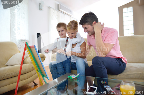 Image of family drawing on school board at home