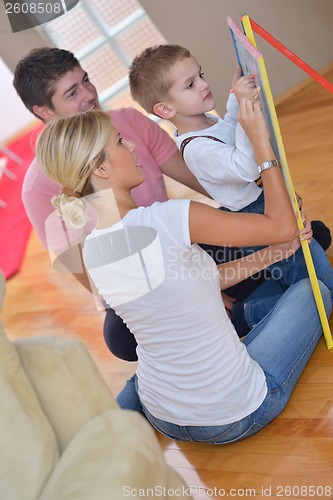 Image of family drawing on school board at home