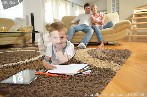 Image of family drawing on school board at home