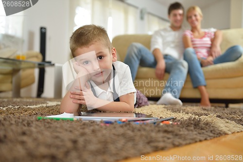 Image of family drawing on school board at home