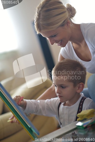 Image of family drawing on school board at home