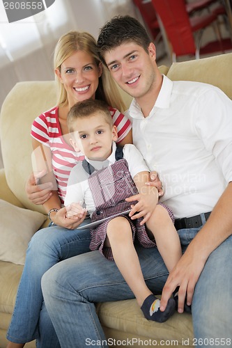 Image of family at home using tablet computer