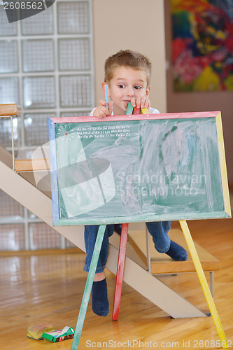 Image of family drawing on school board at home