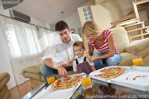 Image of family eating pizza