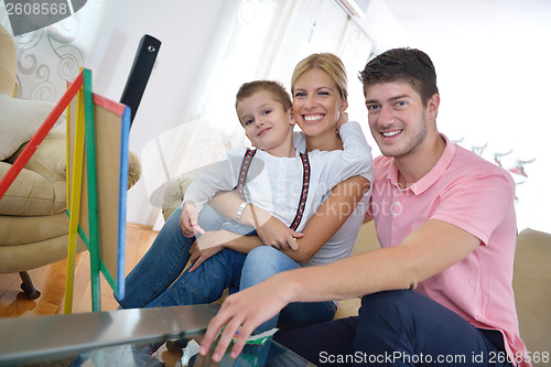 Image of family drawing on school board at home