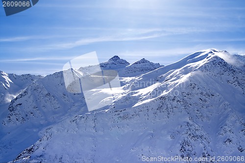 Image of Snowy sunlight mountains, view from off piste slope