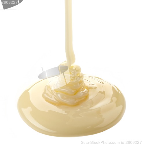 Image of pouring condensed milk on a white background