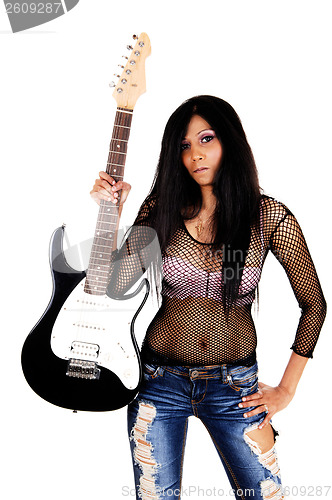 Image of Girl holding her guitar.