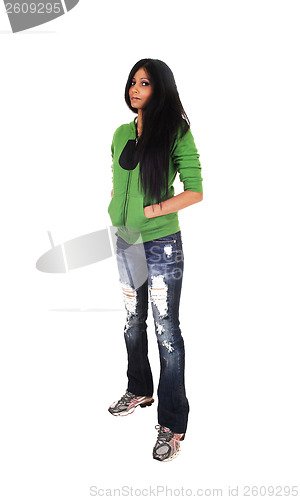 Image of Girl standing in jeans.