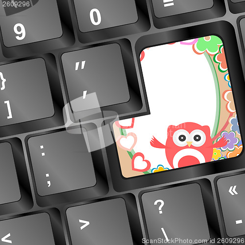 Image of owl on computer keyboard key with love hearts