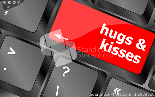 Image of hugs and kisses words on computer keyboard keys