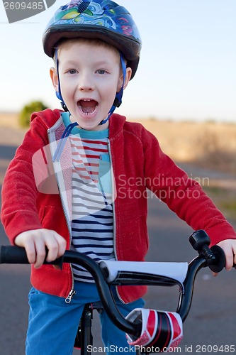 Image of kid riding bike